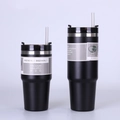 Detail showing 20oz and 30oz vacuum insulated tumblers with matte black finish and straws - Black