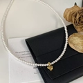 Elegant pearl necklace featuring a polished golden heart pendant on black leather - 24# Necklace—Heart Pendant
