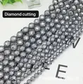 Macro detail of diamond-cut terahertz beads showing metallic faceted texture and luster - Terahertz Diamond Cut
