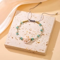 Bohemian seashell beaded bracelet with blue beads and adjustable grey cord closure - Qnw2952 - Shell Bracelet