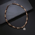 Bohemian beaded necklace featuring brown wood discs, cream beads and a silver sun pendant - Qnn1208 - Coconut Shell Necklace (brown)