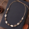 Bohemian seashell necklace with white and gold shells on brown woven cord - By0012 - Seashell Necklace