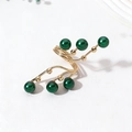 Gold coiled wire ring featuring six deep green pearl accents in a branch design - One Size / Green
