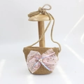 Detail of straw woven kids purse with pink sequin bow and pearl accents on wooden stand - Sequin Mesh Bow - Khaki