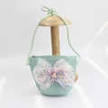 Detail of mint green woven straw crossbody bag for girls with a large pink mesh bow - Sequin Mesh Bow - Green