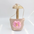 Detail of straw crossbody bag with pink tulle bow, sequins and cute doll figure - Mesh Girl - Pink