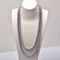 Detail of double-strand dark grey pearl necklace with metallic luster on jewelry bust - 8mm 120CM Long / Gray