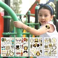 Tatouages éphémères de Nouvel An pour enfants, motifs ballons et champagne noir et or - Peut Être Associé Aux Tatouages ​​temporaires En Feuille D'or Du Nouvel An We041-044 (ensemble De 4).