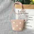 Pink straw crossbody bag for girls featuring handmade crochet daisy floral decorations - Little Daisy - Pink