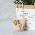 Detail of pink knitted children's crossbody bag with decorative 3D floral accents - Dual Flowers - Pink