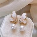 Elegant gold butterfly pearl earrings with sparkling rhinestones on a velvet display stand - Crystal Pink Butterfly (Silver Pin AK003)