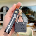 Black EVA mini beach bag keychain with Forever Sport wrist strap and golden metal ring - Black
