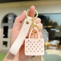 Pink EVA beach bag keychain with silicone wristband and golden metal lobster clasp - Apricot