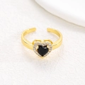 Detail shot of gold heart ring with black stone center and cubic zirconia halo - Gold - Black Zircon (NO.6)