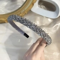 Detail of handcrafted grey crystal beads on a wide headband with elegant sparkling finish - Gray