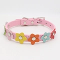Close-up of pink PU leather dog collar with colorful 3D leather flower decorations - Pink