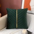 Detail of dark green velvet pillow with diagonal pleats and a gold vertical stripe - Green