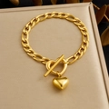 Polished gold stainless steel heart pendant bracelet with toggle clasp on jewelry display - Gold Cuban Chain Heart Toggle Clasp (B2083)