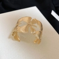 Macro view showing the etched butterfly wing texture on this gold metal cuff bracelet - Butterfly Wings Style (63#) / Gold
