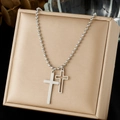 Double cross pendant necklace in silver finish with beaded chain on jewelry box - Solid and Hollow Double Cross Pendant / Steel