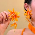 Detailed view of long orange fabric flower earrings with pearl tassels and crystals - 925 Sterling Silver Post Style (27#) / Orange