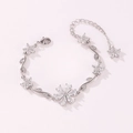 Close-up of silver-tone flower bracelet with marquise-cut crystals and lobster clasp - White-White Gold