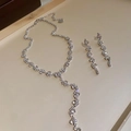 Detailed view of the sparkling rhinestone tassel necklace and earring set in silver - Tassel Necklace Earrings Set Style (52#) / Silver