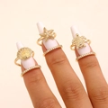 Detail of gold-plated ocean theme rings with shell, starfish, and turtle designs. - Ocean Style Set (95) / Three-Piece Set / Gold