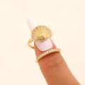 Detailed view of a golden shell-themed nail ring set with sparkling cubic zirconia. - Shell Style (11165) / KC Gold