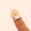 Macro view of ocean-themed gold turtle nail ring set with shimmering cubic zircon stones - Turtle Style (10718) / KC Gold