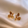 Detail shot of elegant flower stud earrings with amber glass crystals and center pearl - Gold & Coffee (With Silver Pin)