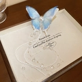 Elegante lichtblauwe vlinder haarspeld met een lange hanger van verfijnde parels - Eendensnavel Clip - Blauw