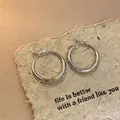 Macro view of minimalist silver hoop earrings on rustic textured handmade paper - Silver Earring Post Silver Hoop (Small) (91#) / Small / Silver