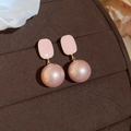 Detailed view of pink enamel square top and lustrous pearl drop stud earrings on brown surface - Pink Pearl Dangle Style (23#) / Gold Pink