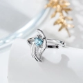 Elegant silver angel wing ear cuff with a vibrant blue heart zircon and crown detail - Single Piece / Light Sea Blue