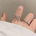 Silver bow knot and butterfly hollow ring set worn on finger for women - Bow Tie Hollow Butterfly Silver Stackable Ring Set (2947)