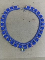Elegant handmade blue glass beaded lace necklace with gold accents and colorful charms - Blue