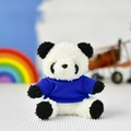 Close-up detail of a small plush panda toy wearing a blue shirt as a bag charm. - Deep Blue T-Shirt