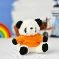 Close-up detail of a cute panda plush toy keychain wearing a vibrant orange knitted sweater - Orange T-Shirt