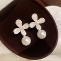 Detailed view of elegant silver flower earrings with white pearl drops on brown velvet box - Pink Pearl Flower Style (46#) / Silver