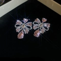 Close-up of elegant pink crystal bow earrings with silver needles on black velvet - Vintage Pink Gem Style (27#)