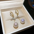 Close-up view of elegant gold-plated pearl earrings with zircon mermaid tail detail in box. - Gold Plated Mermaid Tail Pave Zirconia Style (22#) / Gold