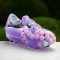 Macro shot of purple translucent sneaker keychain filled with pastel liquid beads - Purple
