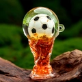 Detailed macro view of soccer trophy acrylic keychain with moving sand and liquid - Red