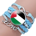 Close-up of sky blue multilayer bracelet with Palestine flag gem and Love charm - Sky Blue