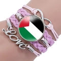 Detailed view of Palestine flag cabochon on a pink multi-layer infinity love bracelet - Pink
