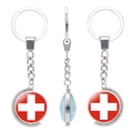 Rotating metal keychain with double-sided Swiss flag glass cabochon pendant detail - Swiss