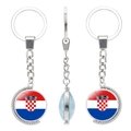 Rotating silver keychain featuring the Croatia flag and coat of arms under glass - Croatia