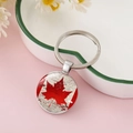 Round silver keychain featuring a Canada flag maple leaf glass dome pendant - Vintage Texture Maple Leaf Design (CC002398-5)