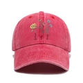 Detail of vintage red washed cotton baseball cap featuring floral embroidery and script text - Red